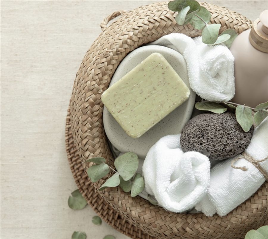 Rolled luxury spa towels and bathroom essentials